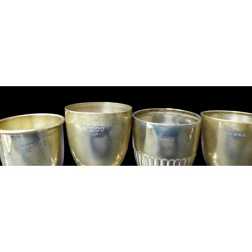 102 - A group of silver items, comprising nine small goblets and trophies,mostly Edwardian,14.5 to 9cm hig... 