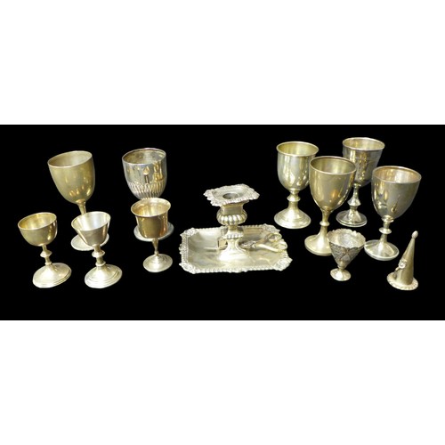 102 - A group of silver items, comprising nine small goblets and trophies,mostly Edwardian,14.5 to 9cm hig... 
