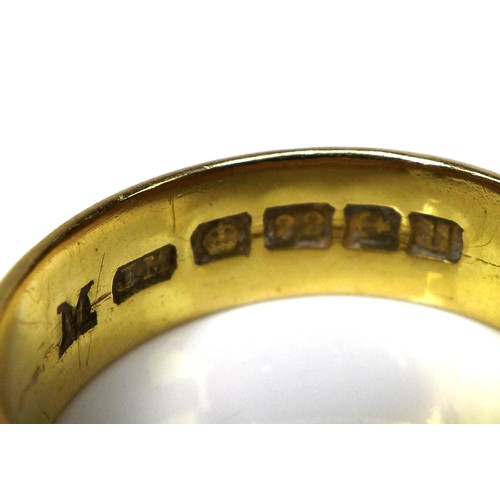 322 - A 22ct gold band, size L/M, 5mm wide, 8.1g.