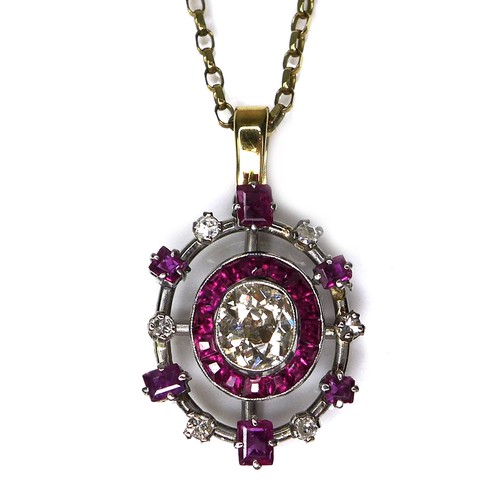 376 - A diamond and ruby pendant, formed of a central old oval cut diamond, 6.1 by 5.3 by 3.4mm, approxima... 