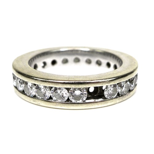 379 - A white gold and diamond eternity ring, each of the 23 brilliant cut stones 3mm diameter, a/f one mi... 