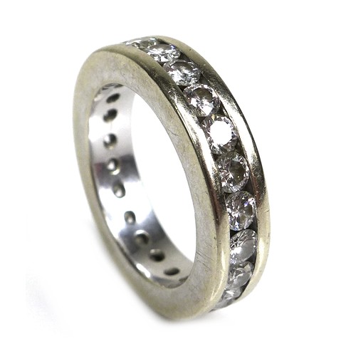 379 - A white gold and diamond eternity ring, each of the 23 brilliant cut stones 3mm diameter, a/f one mi... 