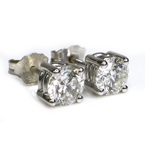 374 - A pair of 18ct white gold and diamond stud earrings, each brilliant cut stone 5.5mm diameter by 3.5m... 