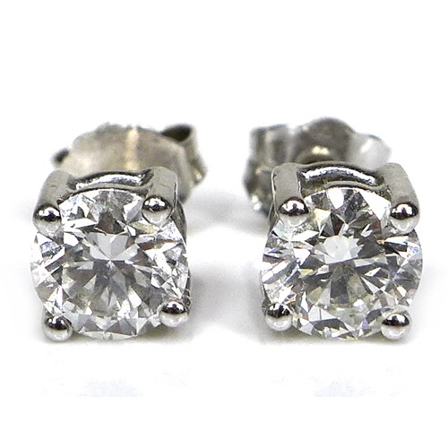 374 - A pair of 18ct white gold and diamond stud earrings, each brilliant cut stone 5.5mm diameter by 3.5m... 