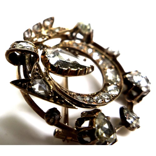 372 - A Victorian multi-stone diamond pendant brooch, set with twenty six diamonds, the central, largest s... 