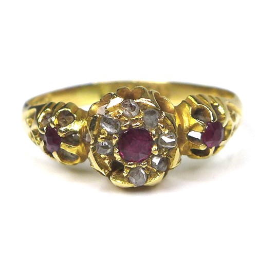 297 - An 18ct gold, ruby and diamond ring, with central rose cut ruby surrounded by seven old cut diamonds... 