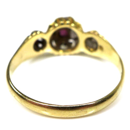 297 - An 18ct gold, ruby and diamond ring, with central rose cut ruby surrounded by seven old cut diamonds... 