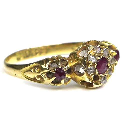 297 - An 18ct gold, ruby and diamond ring, with central rose cut ruby surrounded by seven old cut diamonds... 