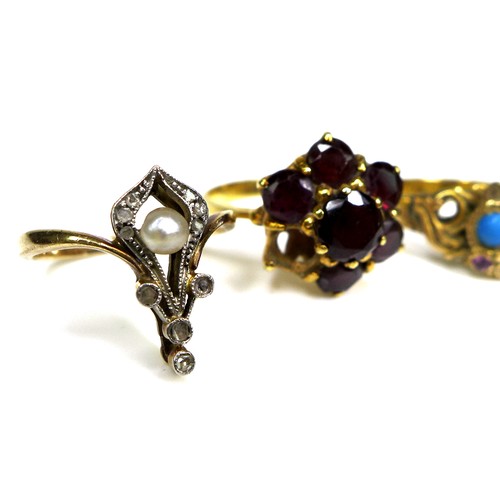 296 - A group of gold rings, comprising an 18ct gold and garnet flowerhead ring, a/f one stone missing, si... 