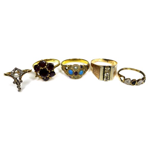 296 - A group of gold rings, comprising an 18ct gold and garnet flowerhead ring, a/f one stone missing, si... 