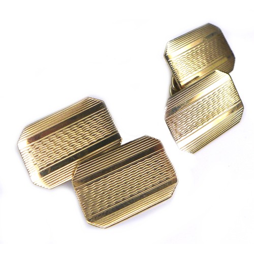 267 - A pair of vintage 9ct gold cufflinks, of canted rectangular form with engraved decoration, chain lin... 