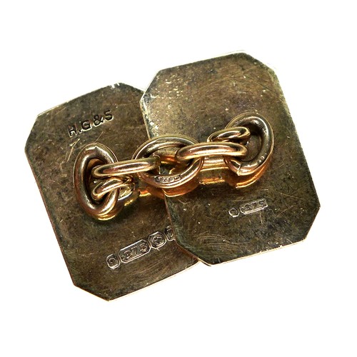 267 - A pair of vintage 9ct gold cufflinks, of canted rectangular form with engraved decoration, chain lin... 