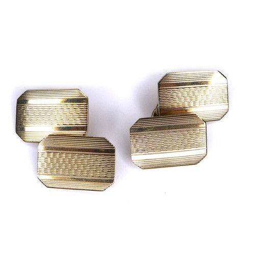 267 - A pair of vintage 9ct gold cufflinks, of canted rectangular form with engraved decoration, chain lin... 