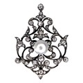 A Victorian diamond and pearl metamorphic necklace, set centrally with a pearl, 8mm, surrounded by f... 