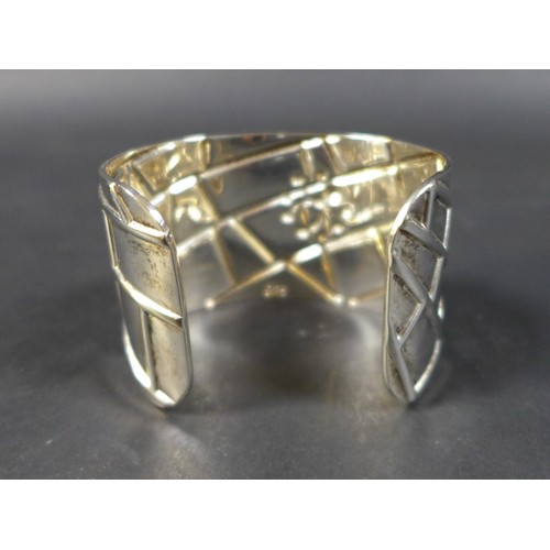 275 - A Tiffany & Co. silver web cuff bangle, designed by Elsa Peretti, with spider and web design, 1.8toz... 