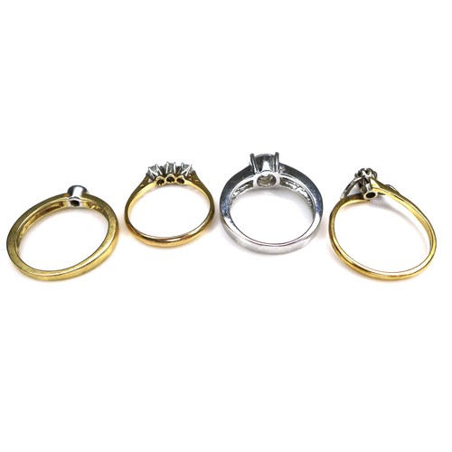 334 - A group of four rings, comprising an 18ct yellow gold diamond solitaire ring, set with a 0.1ct, 3.0m... 