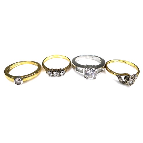 334 - A group of four rings, comprising an 18ct yellow gold diamond solitaire ring, set with a 0.1ct, 3.0m... 