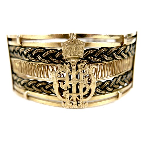 381 - A gold and woven elephant hair cuff bracelet, with the crest of the Emperor of Ethiopia, hinged to o... 