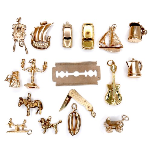 378 - A group of seventeen 9ct yellow gold charms, comprising folding pen knife, candelabra, razor blade, ... 