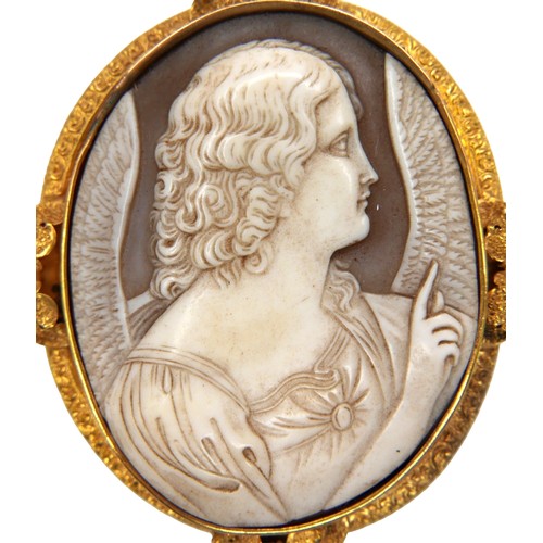 311 - A Victorian oval cameo brooch, depicting an angel in profile, in a gold scrolling mount with leaf de... 