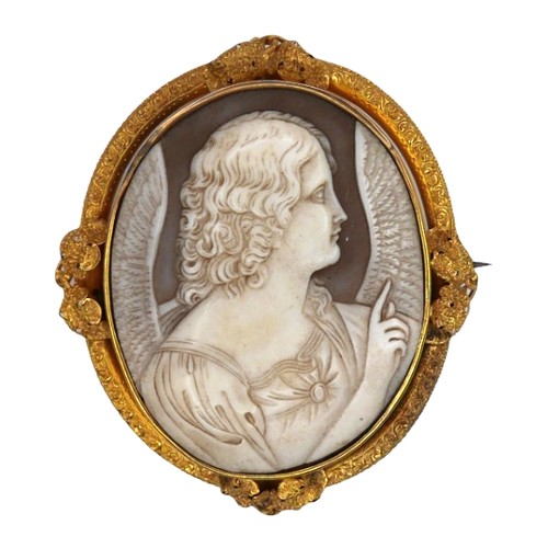 311 - A Victorian oval cameo brooch, depicting an angel in profile, in a gold scrolling mount with leaf de... 