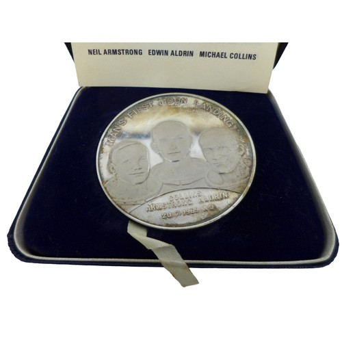 128 - A collection of first Moon landing coins, comprising a limited edition 