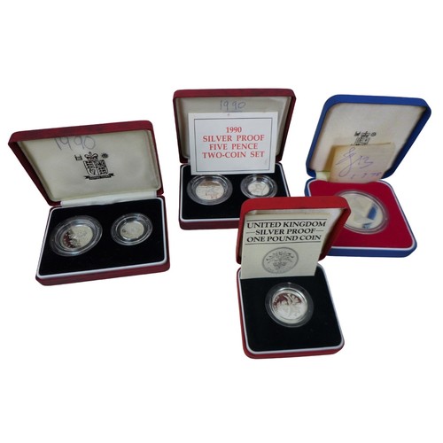 143 - A collection of British proof coins, including six cased sets of silver proof coins with certificate... 