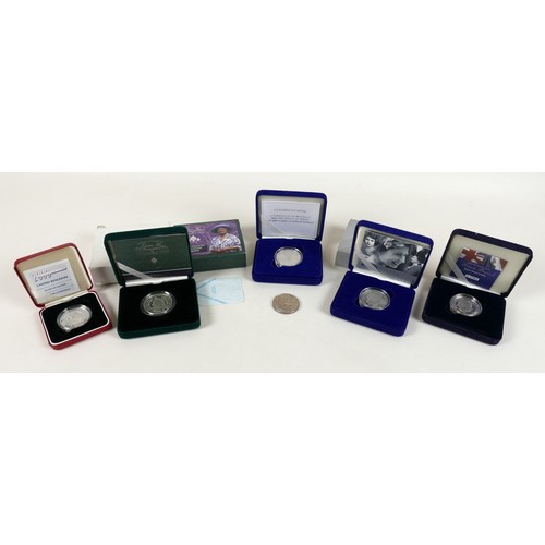 130 - A collection of ERII silver coins, comprising six Royal Mint silver proof crowns, including one pied... 