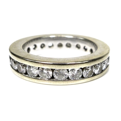 379 - A white gold and diamond eternity ring, each of the 23 brilliant cut stones 3mm diameter, a/f one mi... 