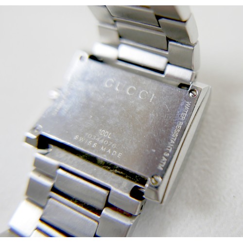 247 - A Gucci stainless steel lady's wristwatch, with diamond set G-shaped bezel, model 100L, serial 10344... 