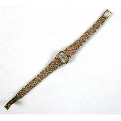 232 - A Cyma by Synchron 9ct gold lady's wristwatch, with rounded rectangular silvered dial, gold batons, ... 