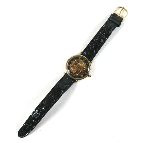 216 - An Ingersoll skeleton gold plated gentleman's wristwatch, case 33mm, on a black strap.
Notes: in wor... 