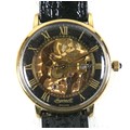 An Ingersoll skeleton gold plated gentleman's wristwatch, case 33mm, on a black strap.
Notes: in wor... 