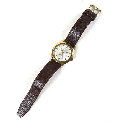 228 - A Geneva gold plated gentleman's wristwatch, with fancy sunburst dial, case 33mm, on a brown strap.
... 