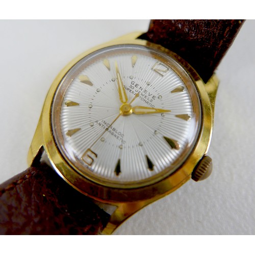 228 - A Geneva gold plated gentleman's wristwatch, with fancy sunburst dial, case 33mm, on a brown strap.
... 