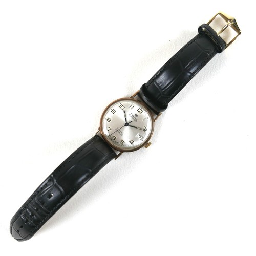 239 - A Delma 9ct gold cased gentleman's wristwatch, with silvered dial, case 33mm, on a black strap.
Note... 