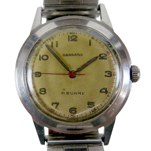 226 - A Garrard / P. Buhre stainless steel gentleman's wristwatch, circa 1957, circular champagne dial, lu... 