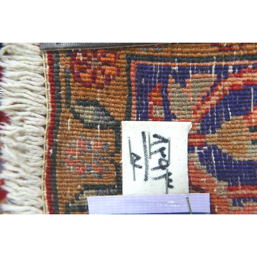 275 - A Bijar rug, on red ground, blue central medallion with pendant anchors, on densely decorated field,... 