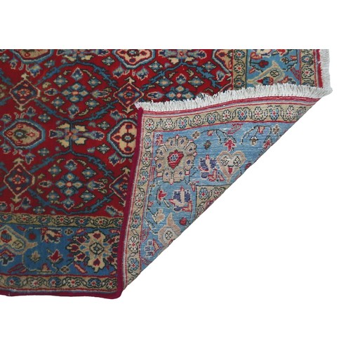 272 - A Hamadan rug, red ground with repeating pattern to central panel, two narrow cream, floral borders ... 