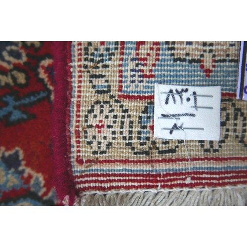 272 - A Hamadan rug, red ground with repeating pattern to central panel, two narrow cream, floral borders ... 