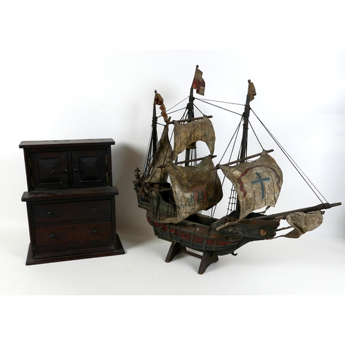 53 - A scratch built wooden model sailing ship, together with a table top cabinet. (2)