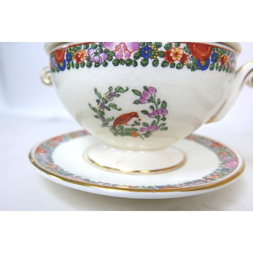 16 - A Royal Worcester Crown Ware part dinner service, in 'Old Worcester Parrot' pattern, comprising thir... 
