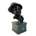 A large bronze bust of a Neapolitan man wearing a hat, with dark green patina, Italian, unsigned but... 