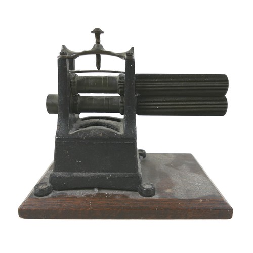 59 - An 19th century iron crimping machine by G. W. Ingram of Birmingham, 23 by 15 by 20.5cm high.