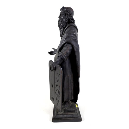 149 - An 18th century carved wooden sculpture of Moses and the Ten Commandments, raised on square plinth, ... 
