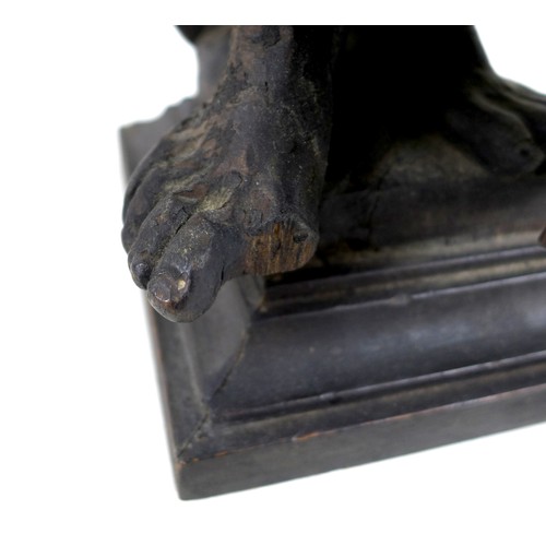 149 - An 18th century carved wooden sculpture of Moses and the Ten Commandments, raised on square plinth, ... 