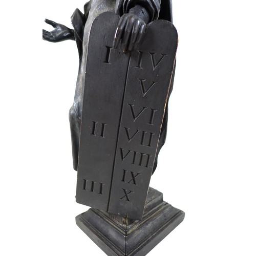 149 - An 18th century carved wooden sculpture of Moses and the Ten Commandments, raised on square plinth, ... 