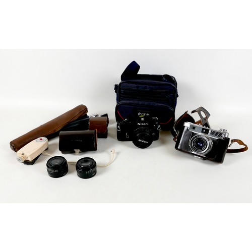 103 - A small group of vintage cameras and accessories, including a Nikon EM camera with series E 50mm 1:1... 