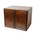 A 18th century oak and fruitwood inlaid table top cabinet, the two doors intricately inlaid with a d... 