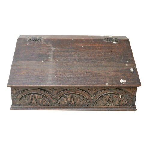 148 - An 18th century oak Bible box, with carved front panel and interior cubby holes, 57.5 by 37.5 by 27c... 